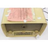 An Ultra radio, cream casing, purchased 21/02/1954, was working when last used,