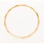 A 9ct gold faceted bangle, internal diameter approx 85 mm, total weight approx 15 gms,
