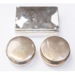 A matched pair of Edwardian circular silver travelling boxes,