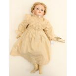 KAMMER REINHARDT: A reproduction bisque head Kammer Reinhardt girl doll, open eyes, closed mouth,