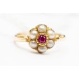 A ruby and seed pearly cluster ring, unmarked 9ct gold,