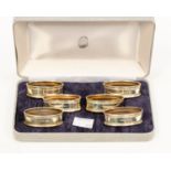 A set of six Elizabeth II shaped oval silver napkin rings, London 1990,
