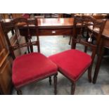 An early 19th Century mahogany fold-over tea table, with a cross-banded edge, parquetry stringing,