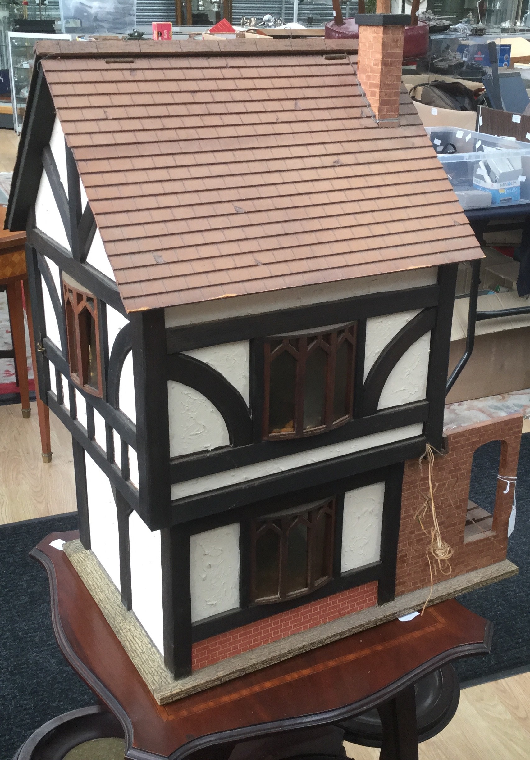 A 20th Century doll's house, modelled as a half timbered mock Tudor house,