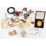 A quantity of Victorian and vintage costume jewellery to include a mourning brooch set with seed