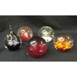 Five Caithness glass paperweights including; Cauldron, Saracen, Starwatch, Moon flower, cerise pink,