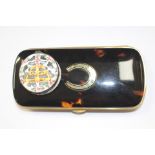 A Bilson enamel style pierced patch box with a tortoiseshell spectacle case.