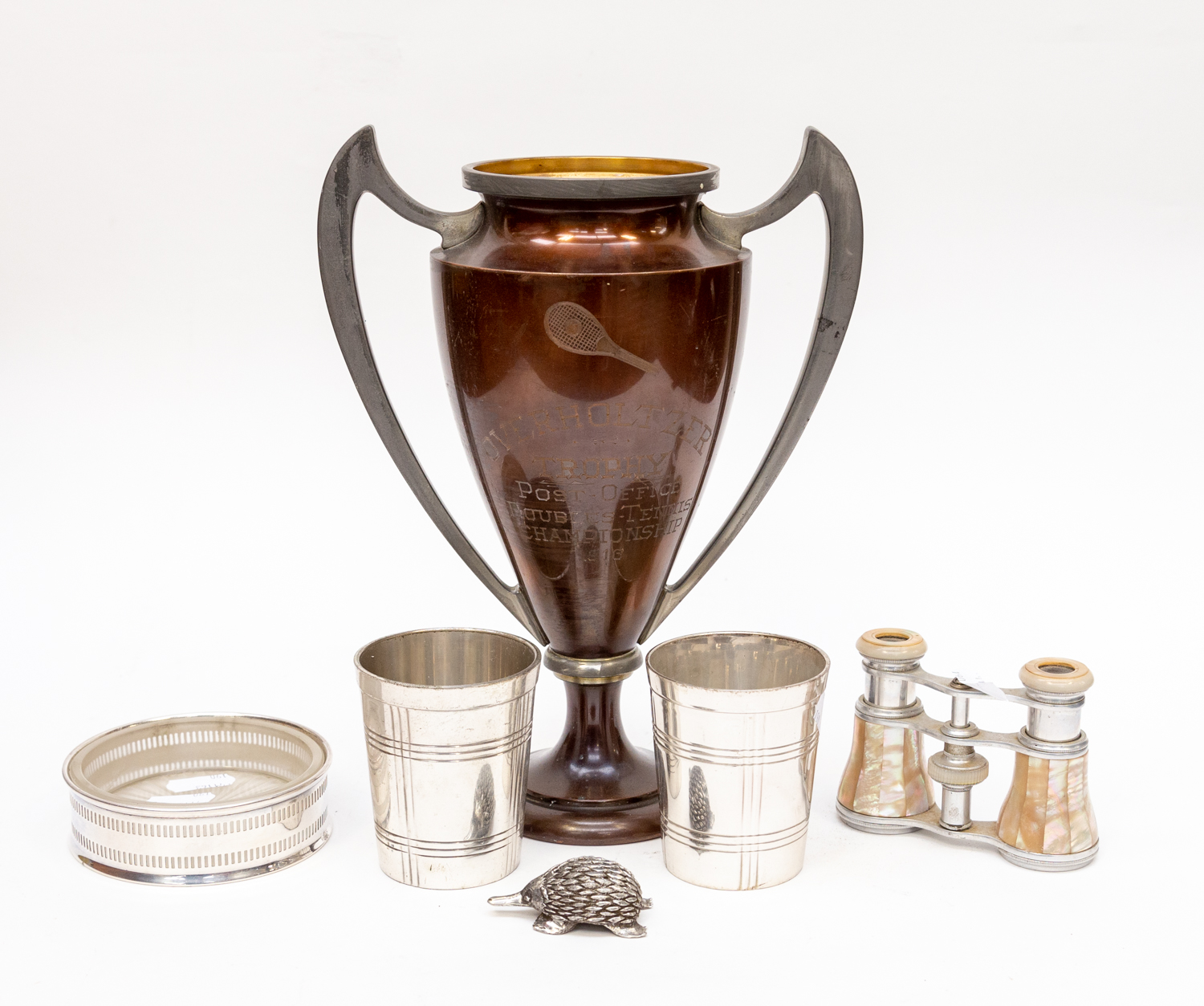 A two handled trophy and two beakers,