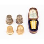 A Victorian 14ct gold and amethyst thimble, chased Greek key style border, stamped AM NM 585,