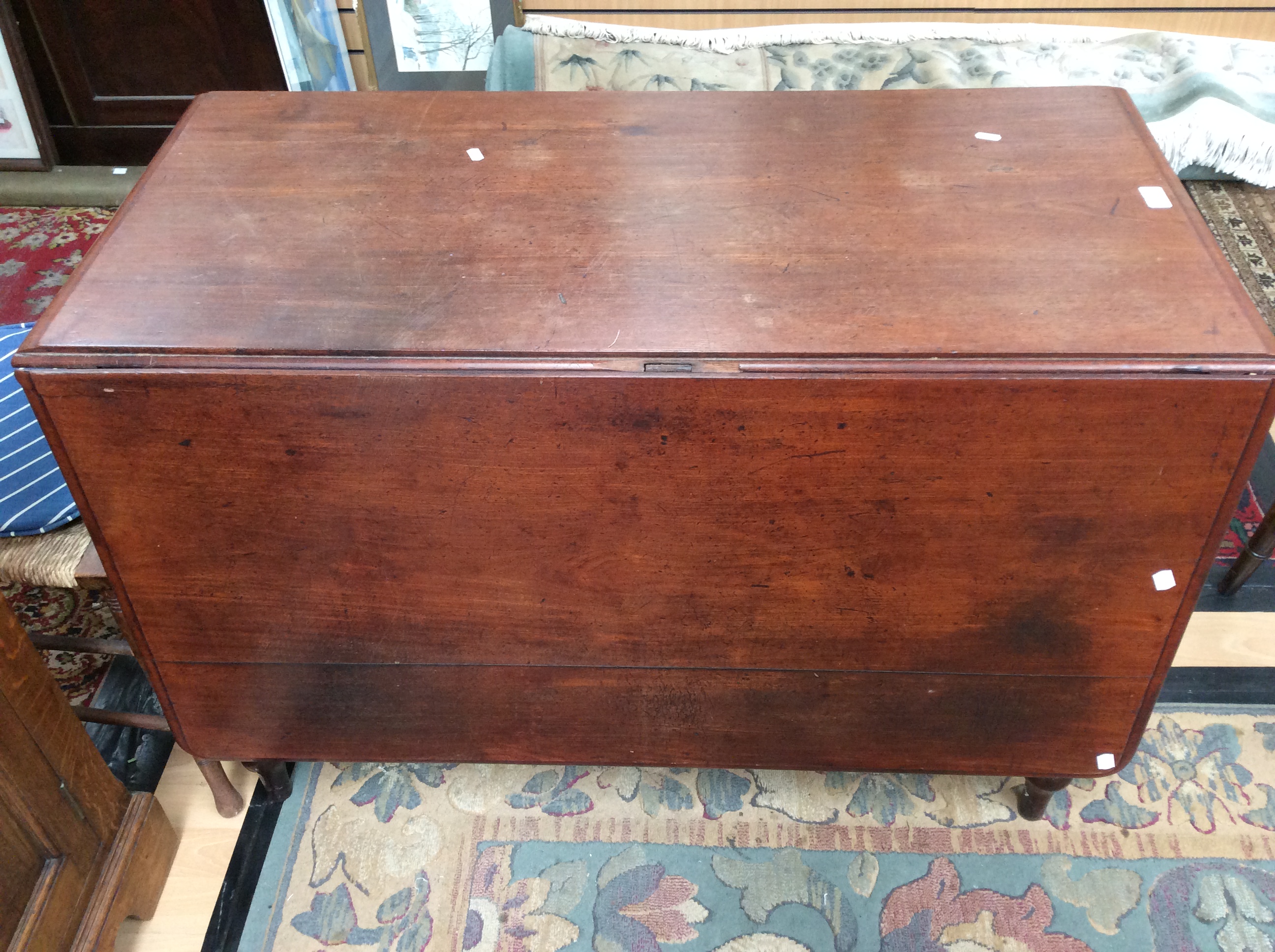 An early Victorian mahogany drop leaf dining table,