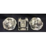 A Kosta cut glass paperweight with an impressed head 68525 along with a pair of Kosta globular form