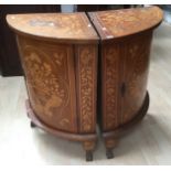 A pair of 20th Century Continental walnut and marquetry inlaid corner cupboards.