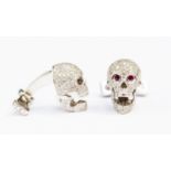 A pair of Deakin & Francis for Ralph Lauren, pave set 18ct white gold skull cufflinks,