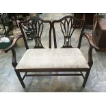 A 19th Century mahogany chair back settee, of camel back form, drop in seat, 90 cms high,