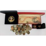 An assortment of costume jewellery along with boxed and loose coins