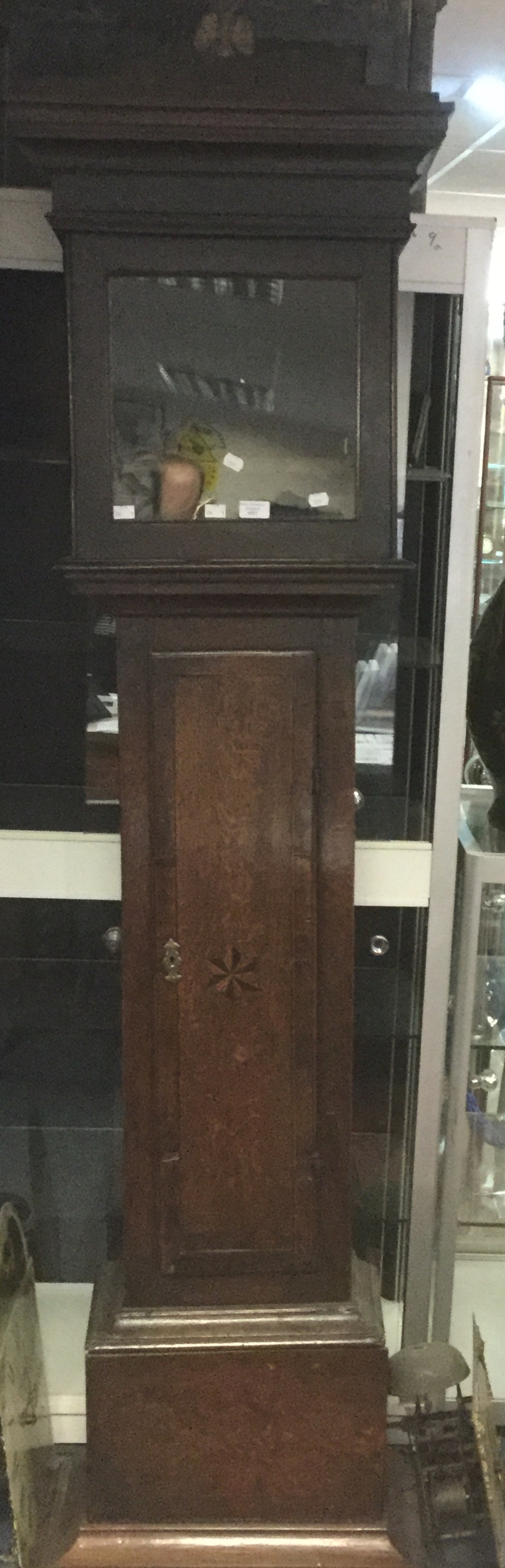 A George II oak and walnut cross banded eight day longcase clock, by Joseph Cooper, Malpas,