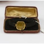 An 18ct gold cased wristwatch, black strap, import marks for London 1934, squared dial,