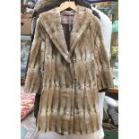 A moleskin full length coat, late 1940's early 50's; a sheepskin fur coat,