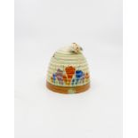 A Clarice Cliff crocus pattern honey pot in the form of a beehive,