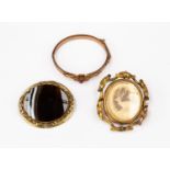 Three items of Victorian gilt metal jewellery comprising a large banded agate brooch,