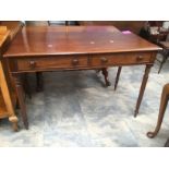 A Victorian two drawer mahogany writing table.