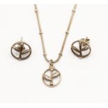 An Ola Gorie boxed silver pendant necklace and earrings set,