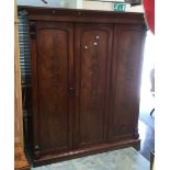 A late Victorian three door wardrobe in mahogany.