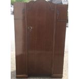 An Art Deco three piece oak bedroom suite with white bakelite handles.