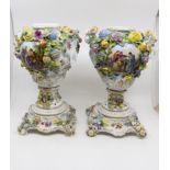 A large pair of Pottschappel Carl Thieme flower encrusted vases covers and stands,