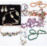 A selection of costume jewellery to include vintage floral glass necklaces and earrings,
