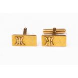 A pair of rectangular cufflinks, applied motif detail, stamped 14ct gold,