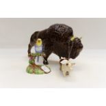 Three porcelain figures including a large Bison, an unmarked pig,
