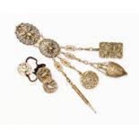A chatelaine clip, which include a notebook and propelling pencil, mirror,