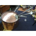 A series of five 19th Century country house graduated copper saucepans, iron handles,