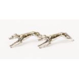 A pair of Art Deco electroplated novelty knife rests modelled as racing greyhounds,