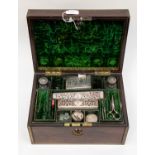 A small wooden companion style box with brass handset containing silver dressing set,