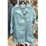 A blue leather 1960's coat, made by Suede & Leathercraft Ltd, made in England.