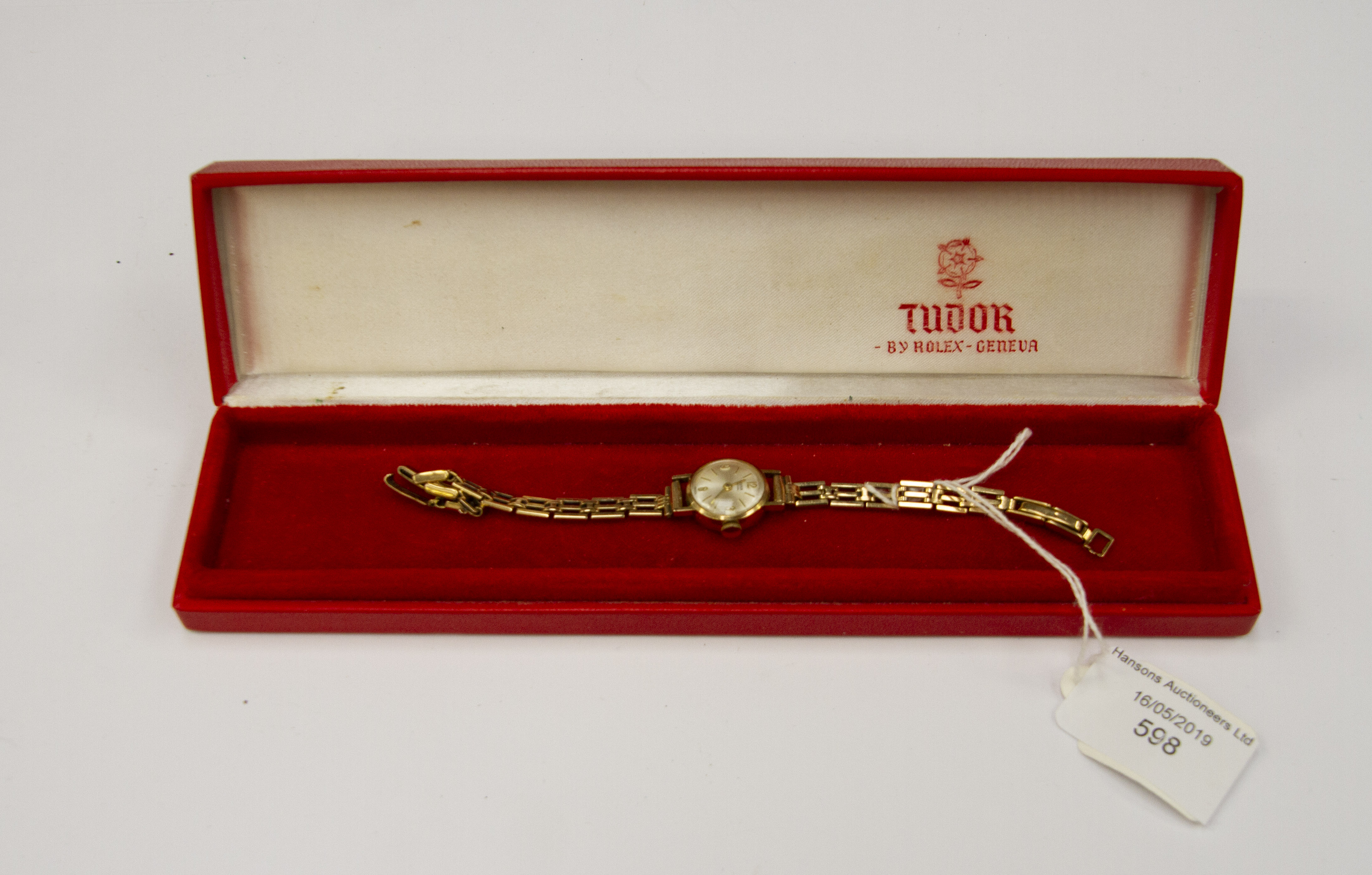 A Tudor Royal, 9ct gold ladies watch, champagne round dial, batons and numbers,