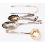 Collection of silver spoons, sugar tongs and ladle,