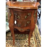 A bow fronted mahogany side table with two drawer