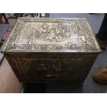 A large Victorian style brass bound rectangular coal skuttle, chased with figures,