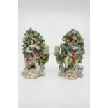 A pair of Derby patch mark figural candlesticks, circa 1760-65,