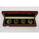 Cased presentation set of St Helena Crowns showing Bird Life. Gold plated with coloured details.