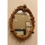 Four early to mid 20th Century wall mirrors