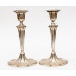 A pair of George V sterling silver candlesticks in the George III style, Sheffield 1918,