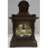 An Edwardian oak eight day mantle clock.