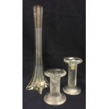 A pair of graduated late 20th Century Scandinavian style moulded glass candlesticks,