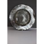 A 15 inch diameter broad rimmed pewter dish by Peter Brocklesbury I or II, PS 1348, circa 1670,