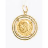 A coin mounted in yellow metal stamped 750,