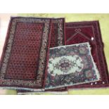 A collection of five various hand knotted woollen rugs,
